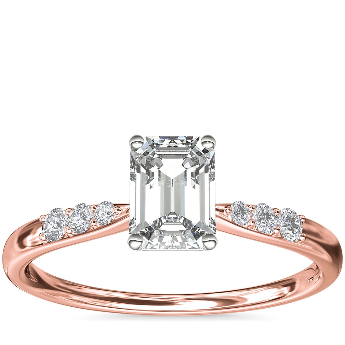 A rose gold engagement ring with an emerald 1-carat diamond.
